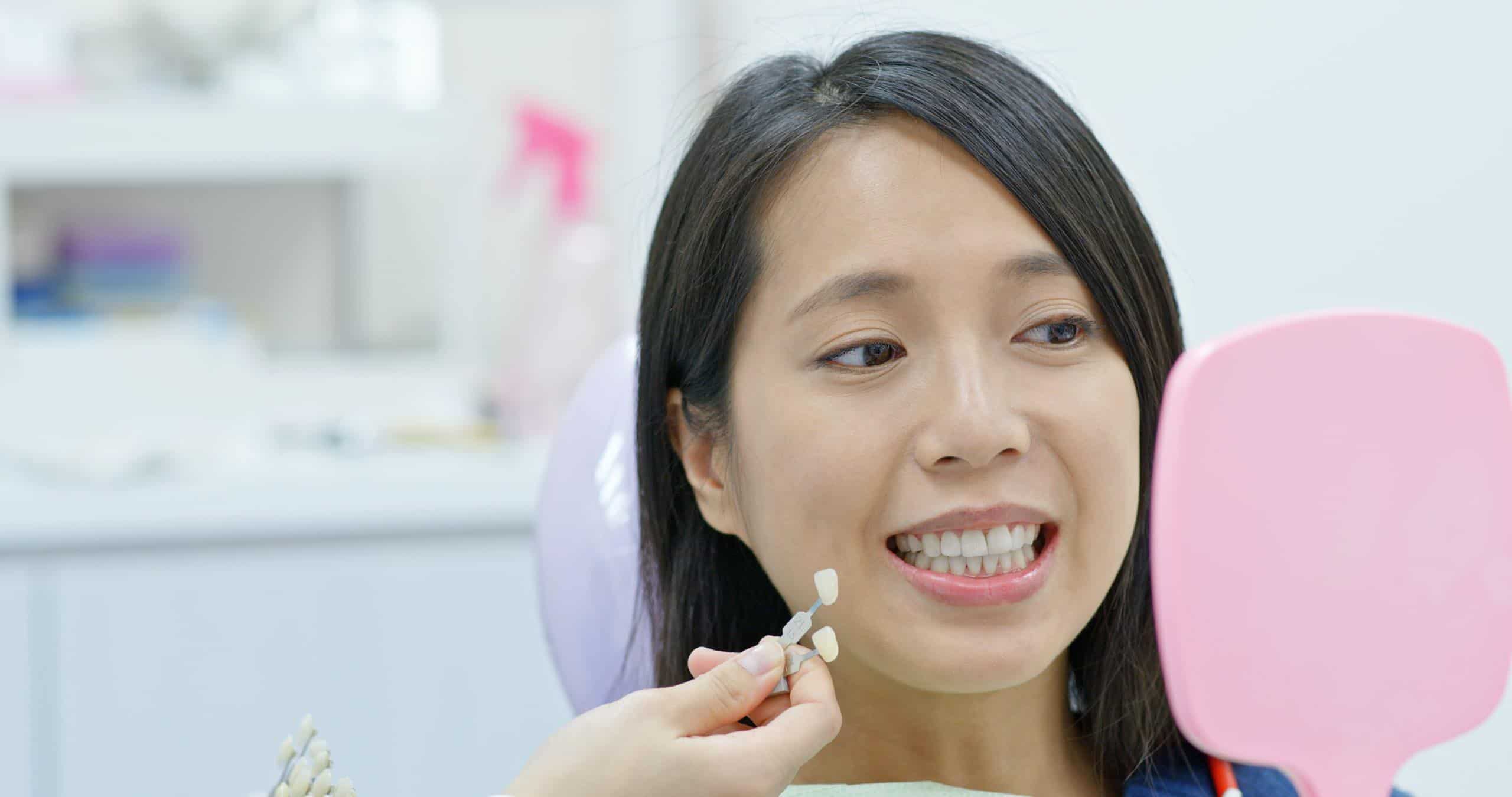 Woman heads to dental clinic for teeth whitening