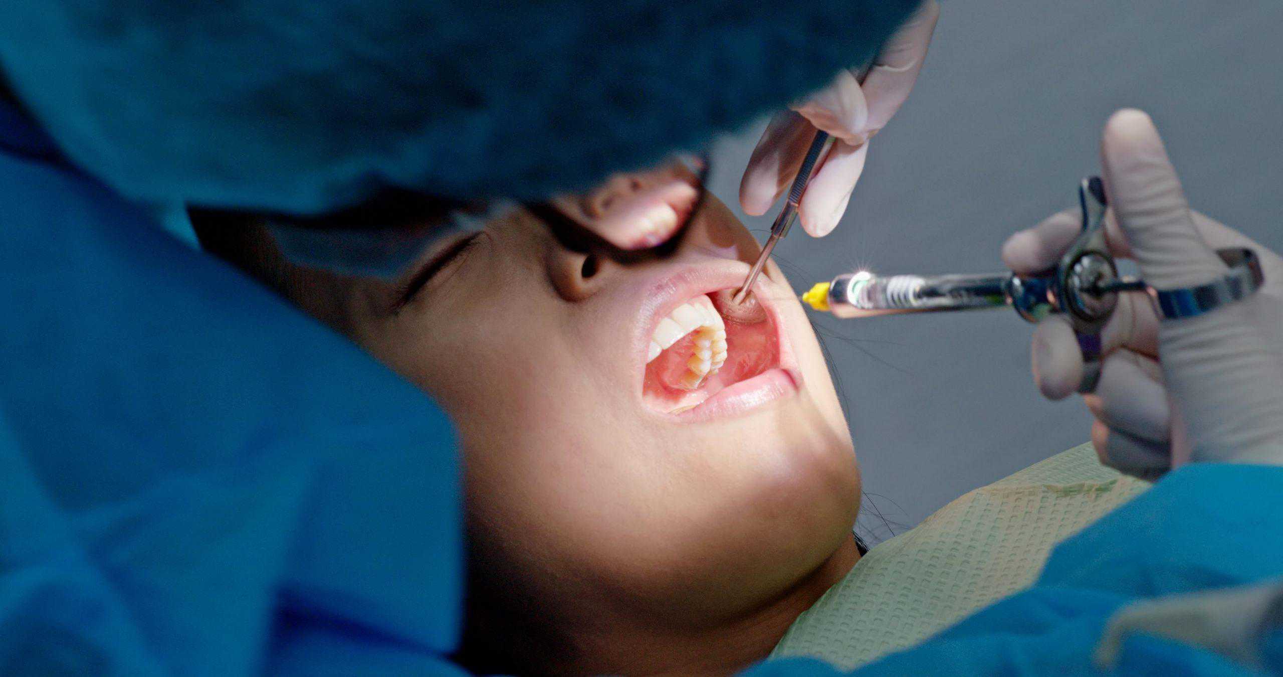 woman having dental care 5QR5FHT min scaled | Elite Dental Group