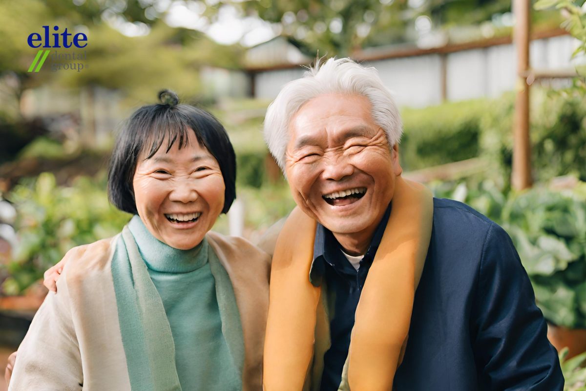 Happy couple after receiving single tooth implant surgery
